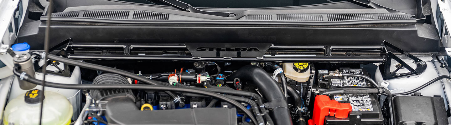 Ford Maverick engine bay with Steeda Competition Strut Tower Brace installed