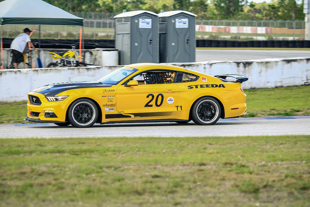 Steeda Yellow #20 Race Car On Track